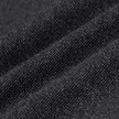 Nahaufnahme der gefalteten Atelier Pants Relaxed in Dunkelgrau aus einem schweren, gebrochenen Twill mit sichtbarer Strickstruktur.